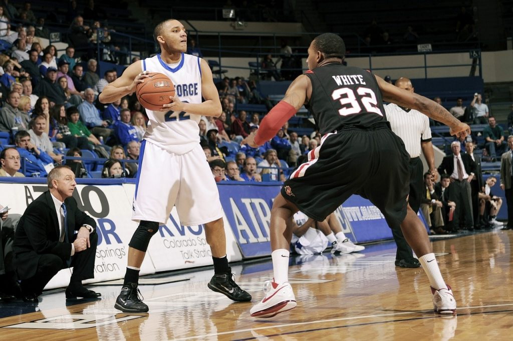 A basketball player about to make a pass.